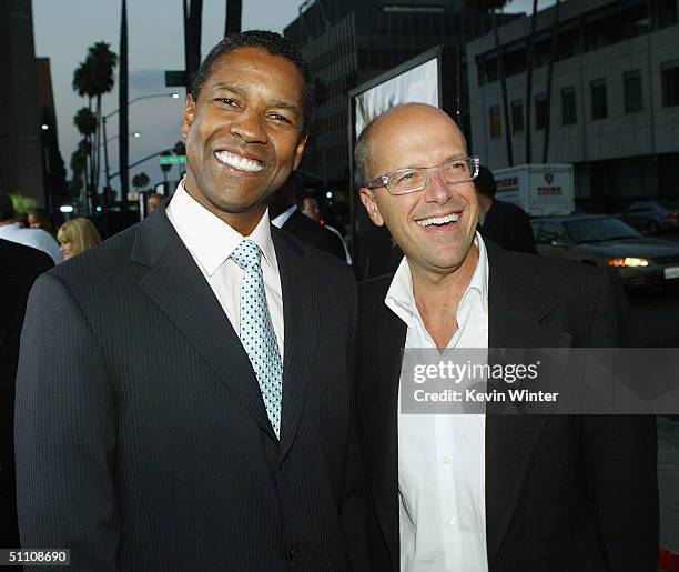 Actor Denzel Washington and Paramounts' Donald DeLine pose at the premiere of Paramounts' "The Manchurian Candidate" on July 22, 2004 at the Samual...