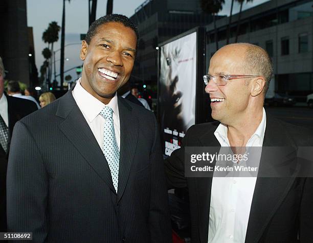 Actor Denzel Washington and Paramounts' Donald DeLine pose at the premiere of Paramounts' "The Manchurian Candidate" on July 22, 2004 at the Samual...