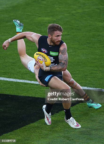 Zach Tuohy of the Blues is challenged by Luke Breust of the Hawks during the 2016 AFL NAB Challenge match between the Hawthorn Hawks and the Carlton...