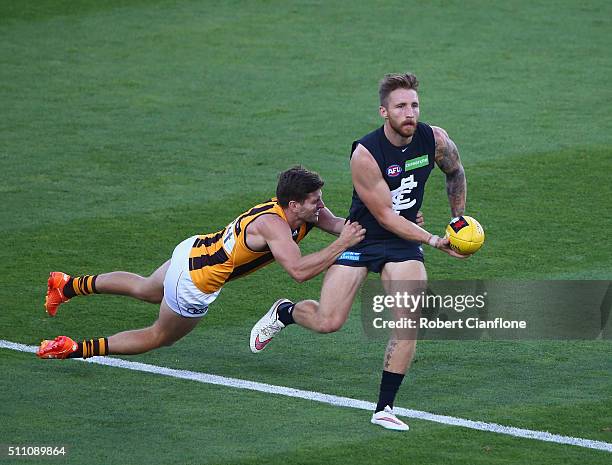 Zach Tuohy of the Blues is challenged by Luke Breust of the Hawks during the 2016 AFL NAB Challenge match between the Hawthorn Hawks and the Carlton...