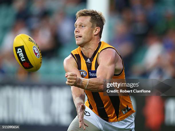 Sam Mitchell of the Hawks handballs during the 2016 AFL NAB Challenge match between the Hawthorn Hawks and the Carlton Blues at Aurora Stadium on...