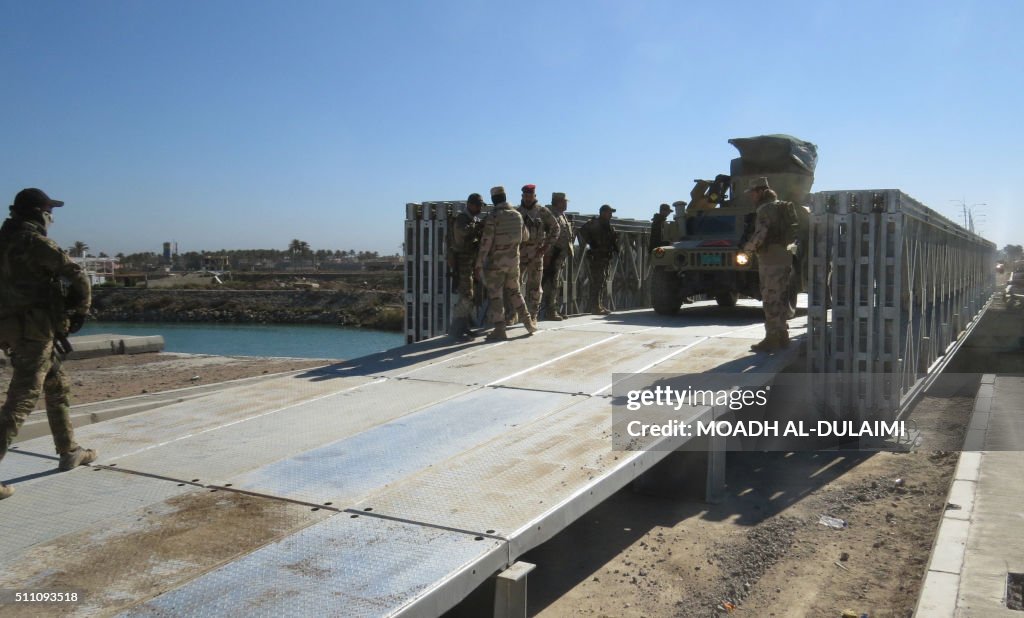 Iraq Bridge Target Iraqi government forces gather on a newly build bridge in the... News ...