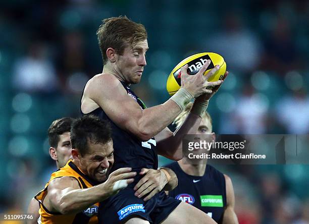 Nick Graham of the Blues is challenged by Luke Hodge of the Hawks during the 2016 AFL NAB Challenge match between the Hawthorn Hawks and the Carlton...