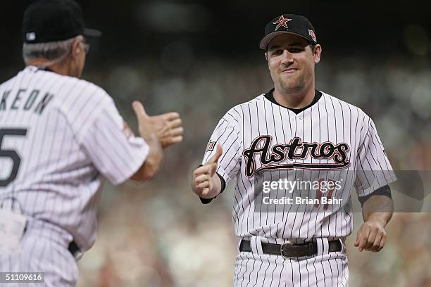 National League All-Star manager Jack McKeon of the Florida Marlins greets NL All-Star outfielder Lance Berkman of the Houston Astros before the...