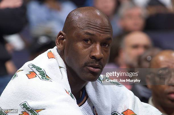 Michael Jordan of the Washington Wizards sits on the bench during a game against the Houston Rockets at the MCI Center on February 18, 2002 in...