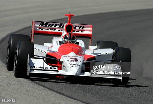 Helio Castroneves drives the Marlboro Team Penske Toyota Dallara during practice for the Indy Racing League IndyCar Series Menards A.J. Foyt Indy 225...