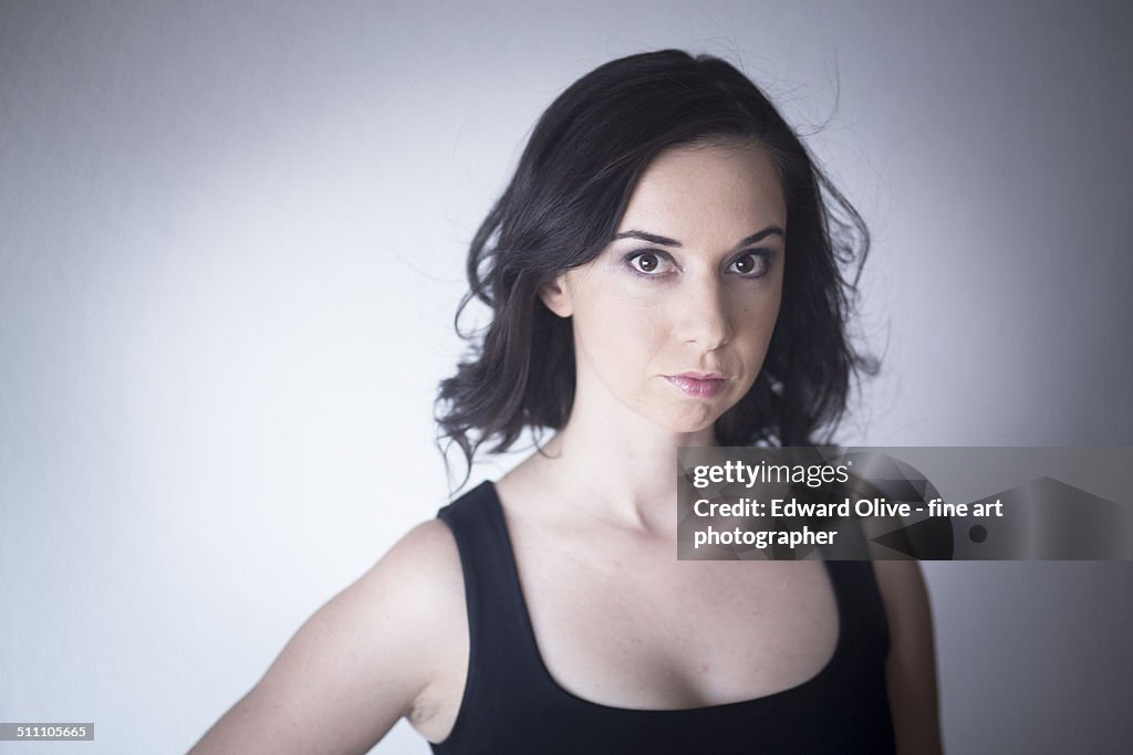 Studio shot portrait of young woman