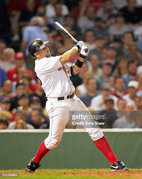 Kevin Millar of the Boston Red Sox hits his third home run of the night to tie their game against the New York Yankees 7-7 in the eighth inning on...