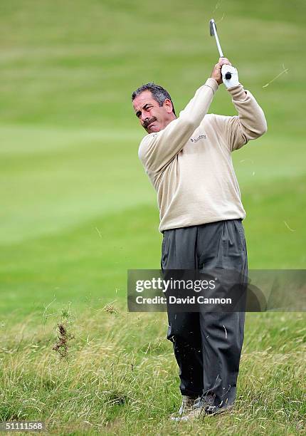 Sam Torrance of Scotland plays his second to the 1st hole during the third round of the Senior British Open on the Dunluce Course at Royal Portrush...