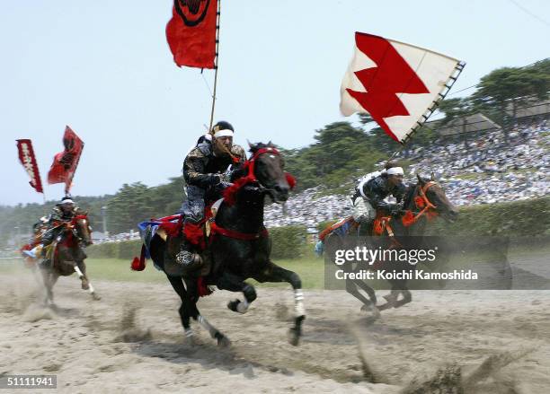 Samurai Riders dressed in full medieval armour take part in an equestrian contest during the Soma-Nomaoi festival on July 24, 2004 in Haramachi City,...
