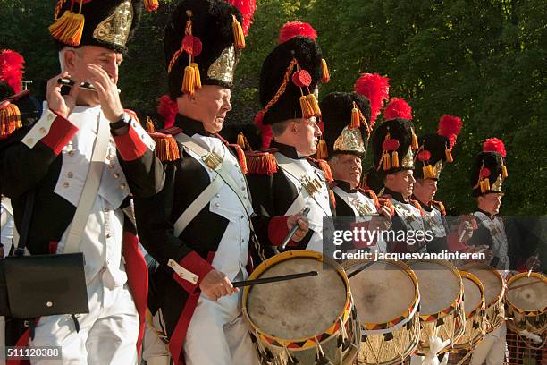 military band during a procession in florennes, belgium - military uniform close up stock pictures, royalty-free photos & images
