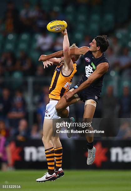 James Sicily of the Hawks is challenged by Blaine Boekhorst of the Blues during the 2016 AFL NAB Challenge match between the Hawthorn Hawks and the...