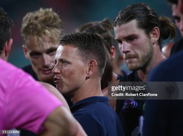 Blues coach Brendon Bolton speaks to his players at he break during the 2016 AFL NAB Challenge match between the Hawthorn Hawks and the Carlton Blues...
