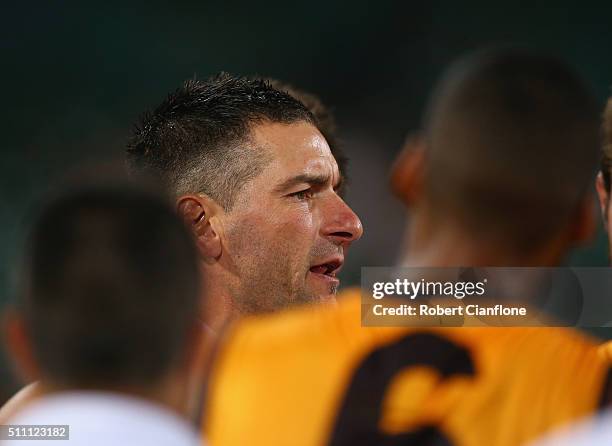 Assistant coach Adem Yze speaks to his players at the break during the 2016 AFL NAB Challenge match between the Hawthorn Hawks and the Carlton Blues...