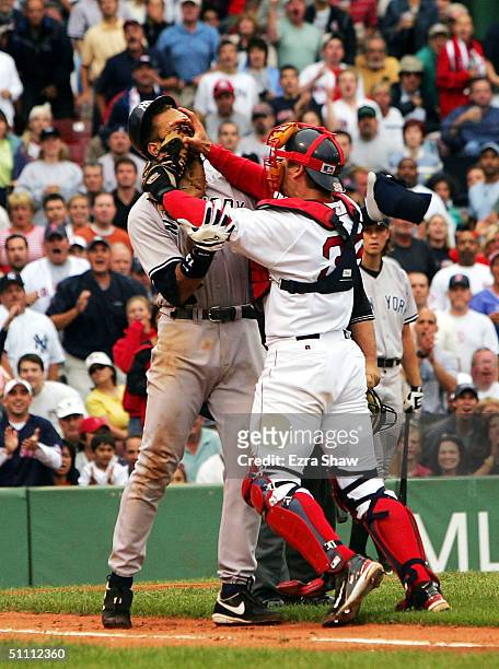 Alex Rodriguez of the New York Yankees gets into a fight with catcher Jason Varitek of the Boston Red Sox after Rodriguez was hit by a pitch in the...