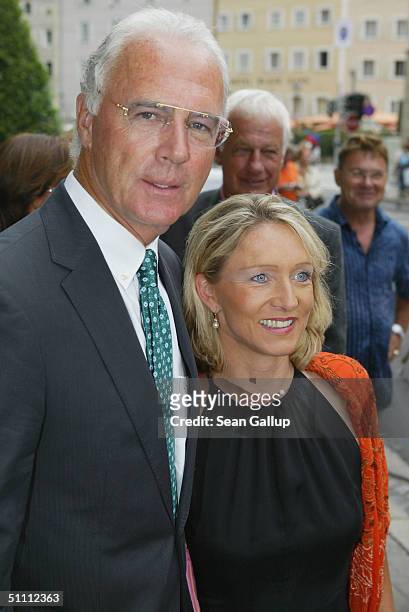 Bayern Muenchen president Franz Beckenbauer and his wife Heidrun Burmester arrive for the first performance of "Jedermann" at the 2004 Salzburg Music...