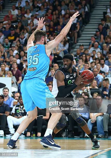 Hakim Warrick of Melbourne United controls the ball as Alex Pledger of the New Zealand Breakers defends during the NBL Semi Final match between...
