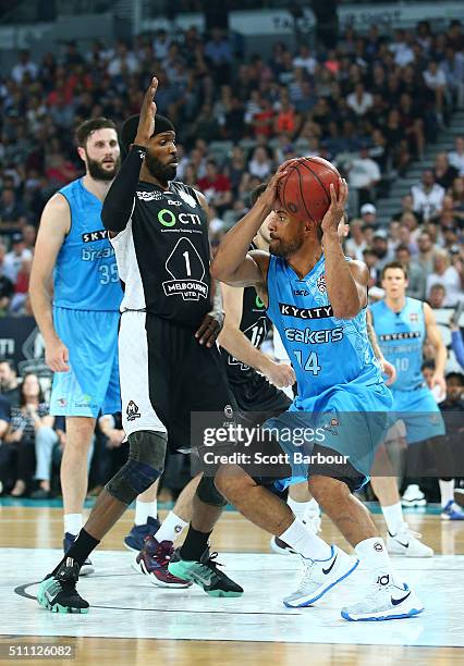 Mika Vukona of the New Zealand Breakers controls the ball as Hakim Warrick of Melbourne United defends during the NBL Semi Final match between...