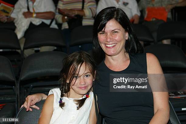 Actress Linda Fiorentino an her niece Lillyann watch the New York Liberty take on the Detroit Shock at Radio City Music Hall on July 24, 2004 in New...