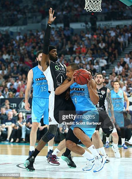 Mika Vukona of the New Zealand Breakers controls the ball as Hakim Warrick of Melbourne United defends during the NBL Semi Final match between...
