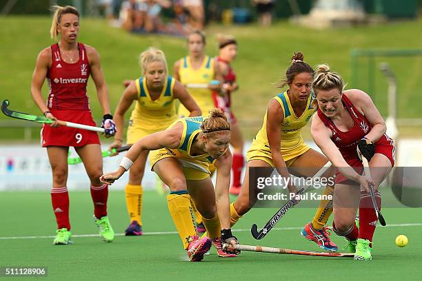 Hollie Webb of Great Britain passes the ball under pressure from Georgia Nanscawen of Australia during the International Test match between the...