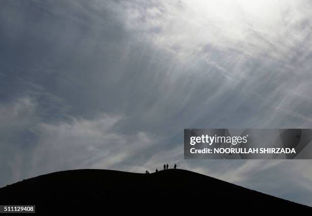 In this photograph taken on February 17 Afghan security forces patrol following an operation against Islamic State militants in Achin district in...