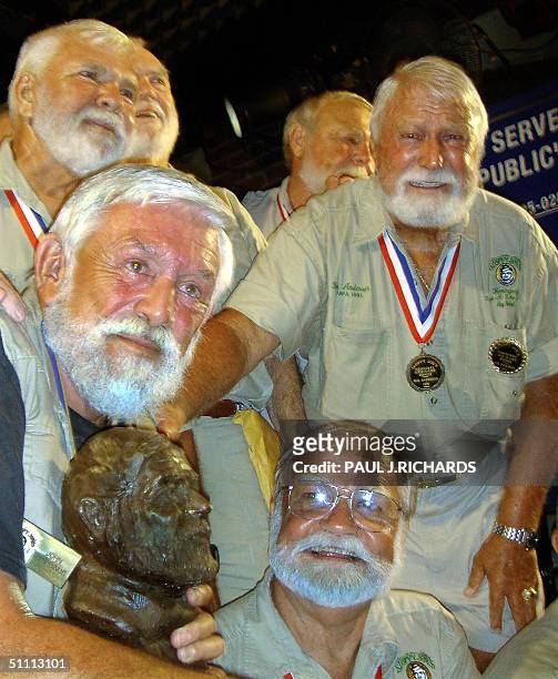 Ernest Hemingway look-a-like John Stubbings , from Kill Devil Hills, North Carolina, holds the winners trophy after being named the 2004 winner of...