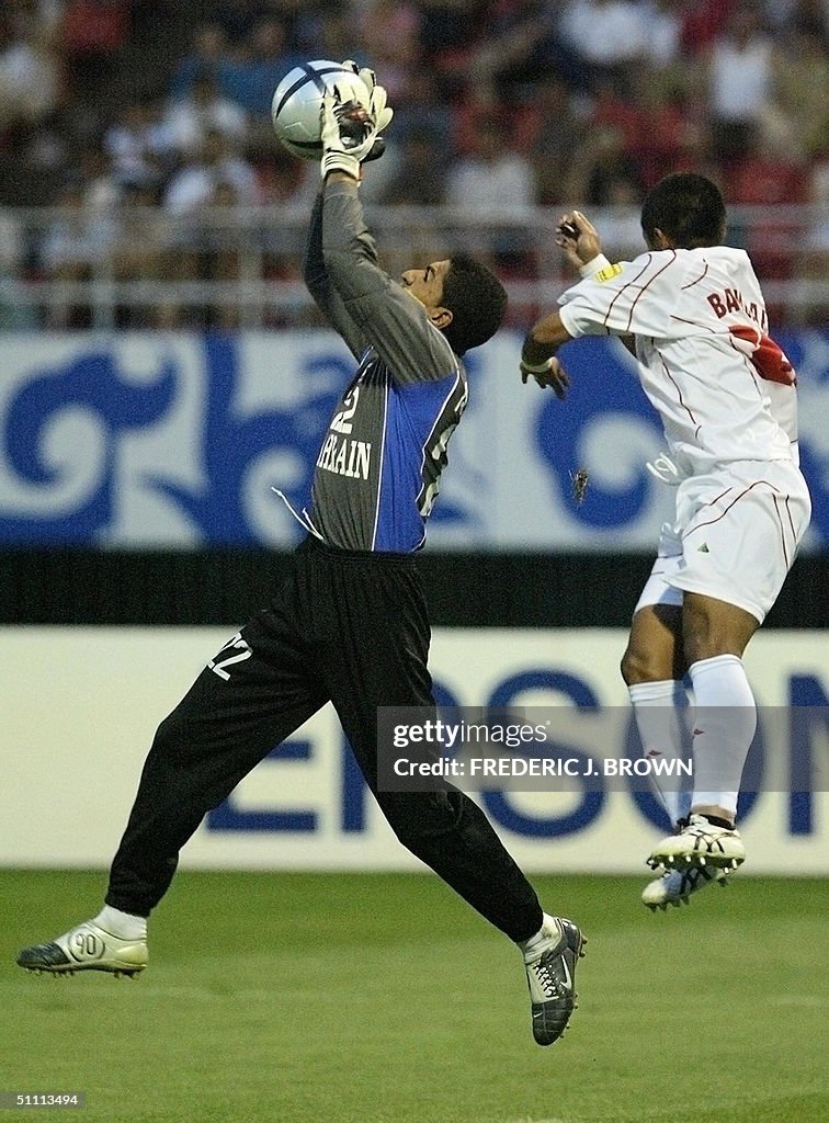 Bahrain goalkeeper Ali Saeed Abdulla col