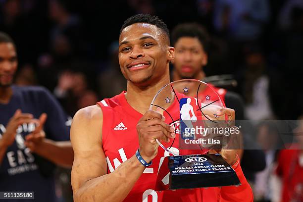 Russell Westbrook of the Oklahoma City Thunder and the Western Conference holds the MVP trophy after defeating the Eastern Conference during the NBA...