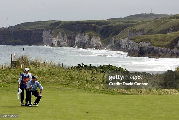 Tom Kite of the USA lines up his putt on the 6th green during the final round of the Senior British Open on the Dunluce Course at Royal Portrush Golf...