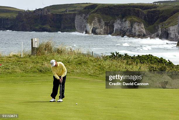 Pete Oakley of the USA putts on the 5th green during the final round of the Senior British Open on the Dunluce Course at Royal Portrush Golf Club on...