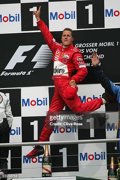 Michael Schumacher of Germany and Ferrari celebrates on the podium after winning the German F1 Grand Prix at the Hockenheim Circuit on July 25 in...