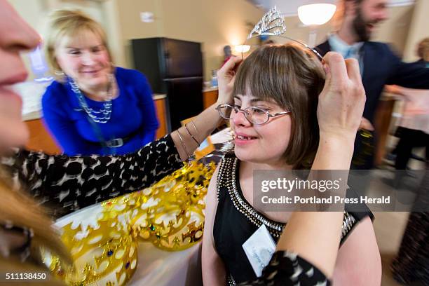 Marie Christie is crowned with a tiara shortly fter arriving at the Night to Shine -- a dance party for people with special needs.