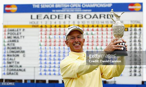 Pete Oakley of the USA poses with the trophy after the final round of the Senior British Open on the Dunluce Course at Royal Portrush Golf Club on...