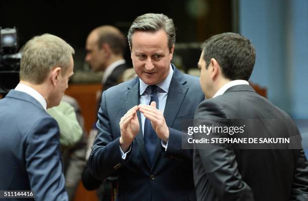 Britain's Prime Minister David Cameron talks with European Council President Donald Tusk and Greece's Prime Minister Alexis Tsipras during an EU...