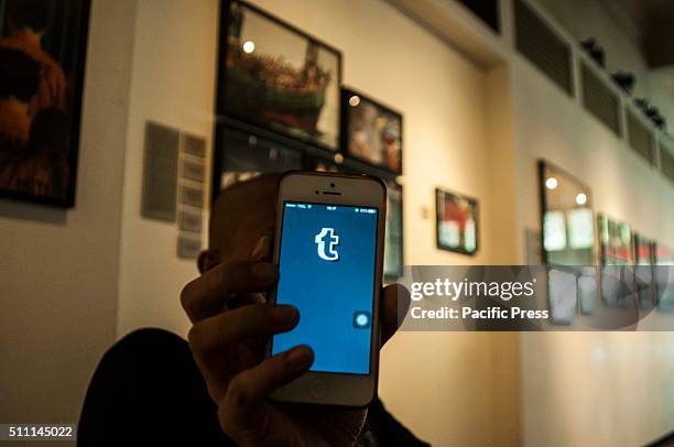 Man holds his mobile phone showing the Tumblr blogging website. According to media reports, the Indonesian Ministry of Communications announced that...