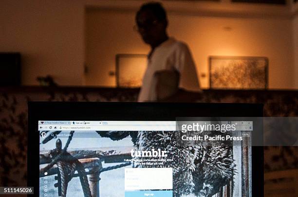 Man walks past a laptop monitor showing the Tumblr blogging website. According to media reports, the Indonesian Ministry of Communications announced...