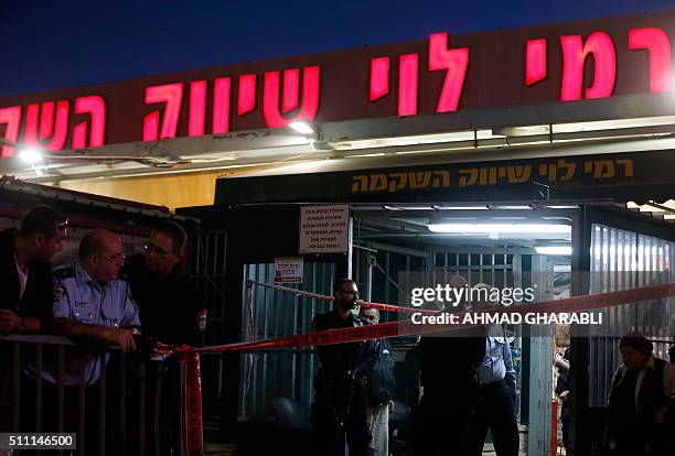 Israeli security forces stand guard outside the Rami Levi supermarket in Shaar Binyamin, near Ramallah in the occupied West Bank, after two...