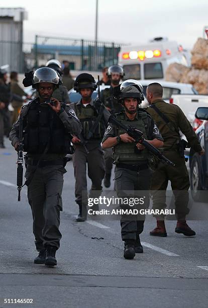 Israeli security forces stand guard outside the Rami Levi supermarket in Shaar Binyamin, near Ramallah in the occupied West Bank, after two...