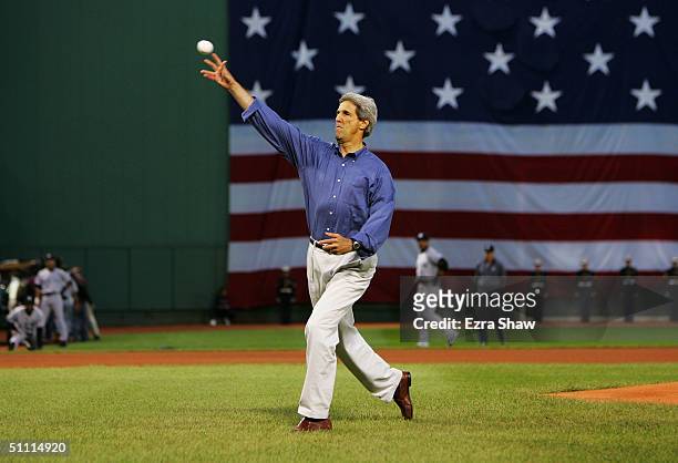 Democratic nominee for president John Kerry throws out the first pitch before the Boston Red Sox game against the New York Yankees on July 25, 2004...