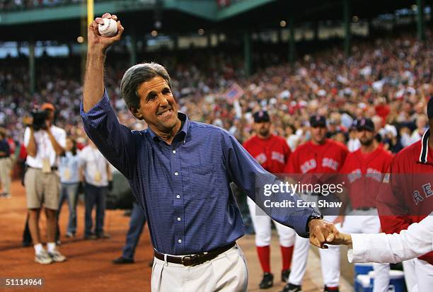 Democratic presidential nominee John Kerry waves to the crowd before he threw out the first pitch before the Boston Red Sox game against the New York...