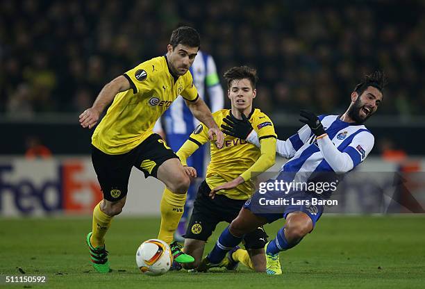 Sergio Oliveira of FC Porto competes for the ball against Sokratis Papastathopoulos and Julian Weigl of Borussia Dortmund during the UEFA Europa...