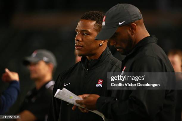 Running back coaches Ray Rice and Priest Holmes of the National Team looks on from the sideline during the NFLPA Collegiate Bowl between the American...