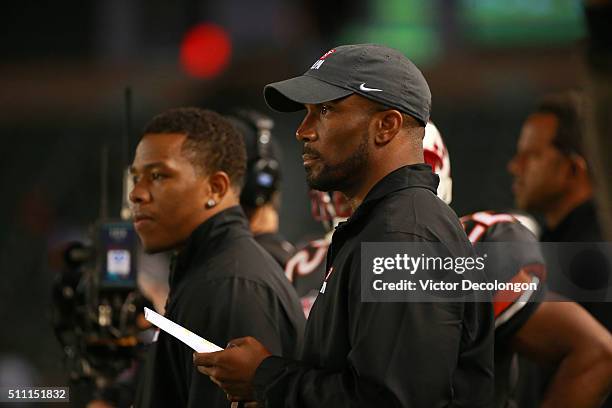 Running back coaches Ray Rice and Priest Holmes of the National Team looks on from the sideline during the NFLPA Collegiate Bowl between the American...