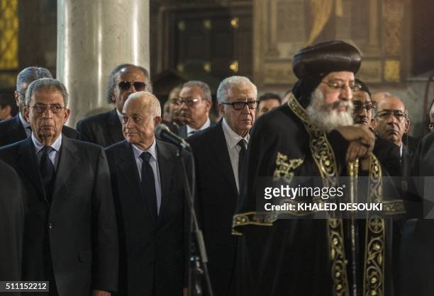 The Arab League's former secretary general, Amr Mussa, and the pan-Arab organisation's current chief, Nabil al-Arabi, stand next to former foreign...
