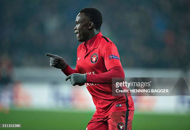 Midtjylland's forward Pione Sisto celebrates scoring the 1-1 goal during the UEFA Europa League Round of 32 football match between Manchester United...