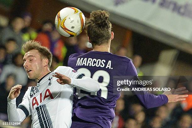 Tottenham Hotspurs midfielder from Denmark Christian Eriksen jumps for the ball against Fiorentina's defender from Spain Marcos Alonso Mendoza during...