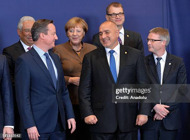 British Prime Minister David Cameron , German Chancellor Angela Merkel and Bulgarian Prime Minister Boyko Borisov pose for a family photo during the...