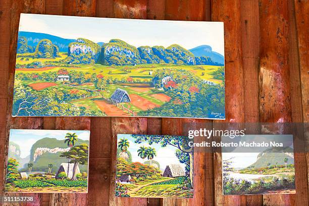 Canvas paintings on display at shop in Vinales Valley in Cuba. The paintings depict the beautiful scenery of the Valley. Vinales Valley is located in...