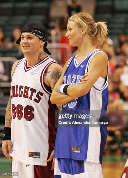 Benji Madden of Good Charlotte and actress Cameron Diaz during the NSYNC Challenge For The Children Celebrity Basketball Game at Office Depot Center...